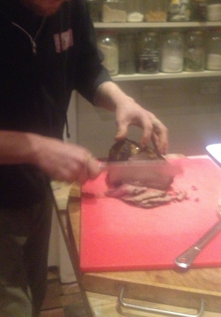 After the meat has rested slice it up. Get your wife to take a dodgy action shot while you do it