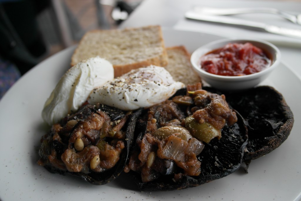 Poached eggs with arrabiatta salsa , side of mushrooms with caponata