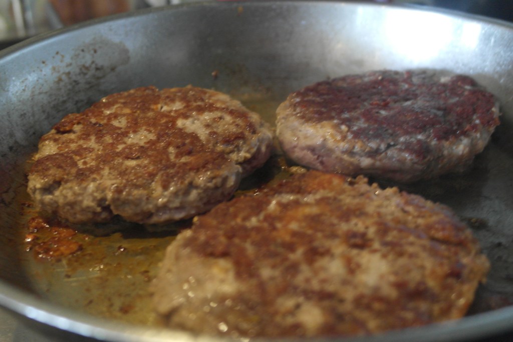 Burgers cooking. Big burgers