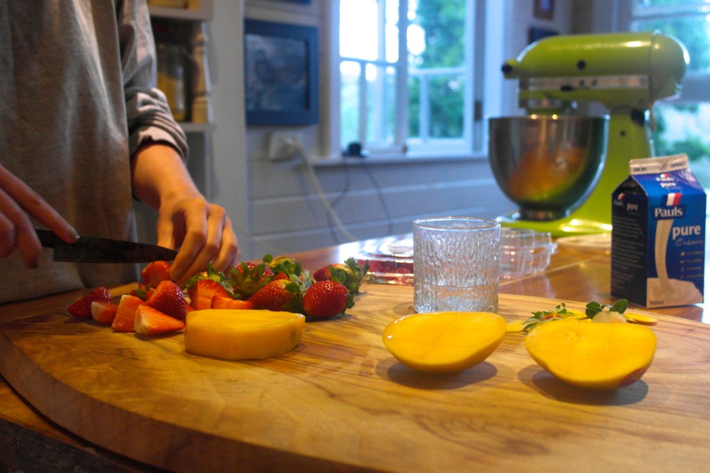 Amelia's hands getting dessert ready. Don't be fooled by all of that fruit… this was not a trendy new age raw fruit cake