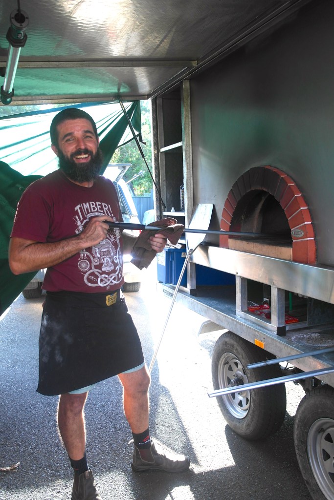 Andrea stoking away... or whatever it is a chief pizza maker does