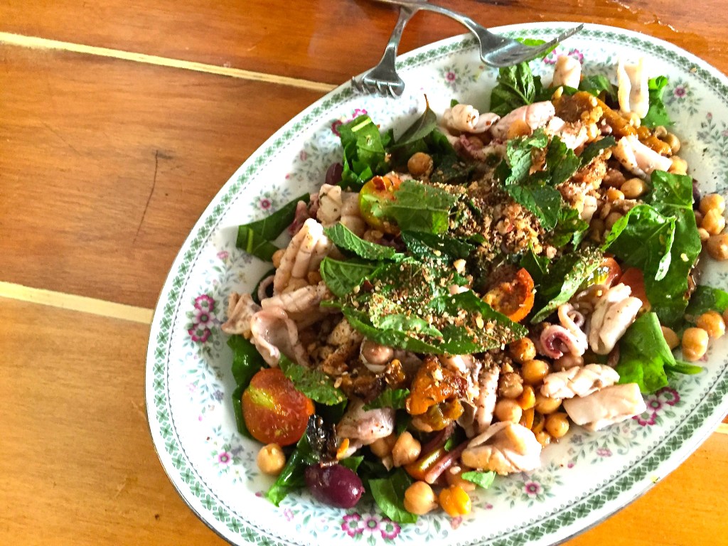 warm salad of squid, chickpeas, olives, tomato, herbs and nutty za'atar