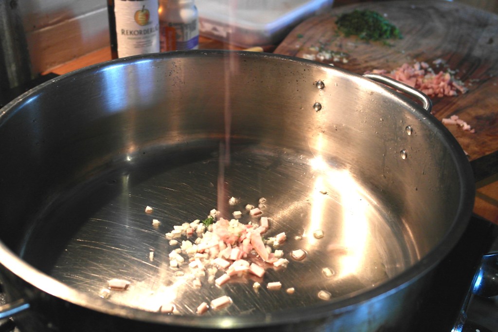 In with he bacon, onion and garlic