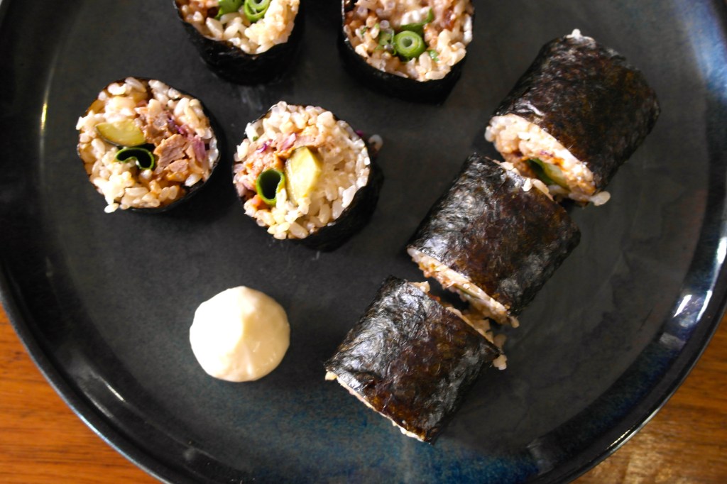 Chop them up so they fit in your mouth and then fit them into your mouth with a little extra QP and possibly some soy and wasabi if you're keen