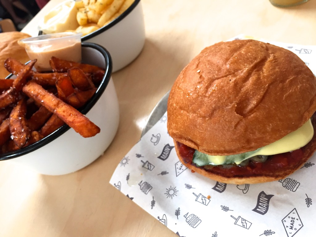 The beef burger sitting aside some very impressive hot chips