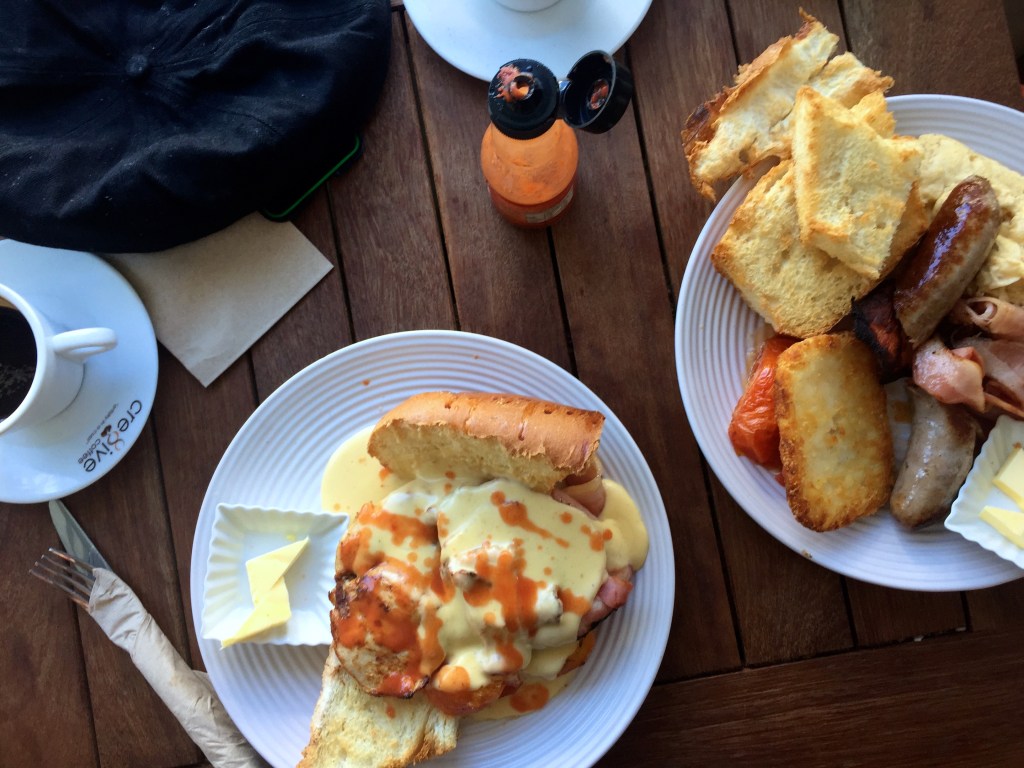 Breakfast at Poboy Cajun and Creole. The farmers breakfast (right) with oven roasted chicken breast, tomatoes, bacon and mornay sauce had me looking for a suitable park bench to nap on