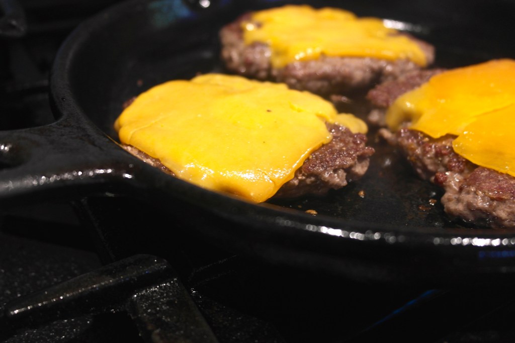 Fry den beef patties and then get some cheese on top so it melts damn you